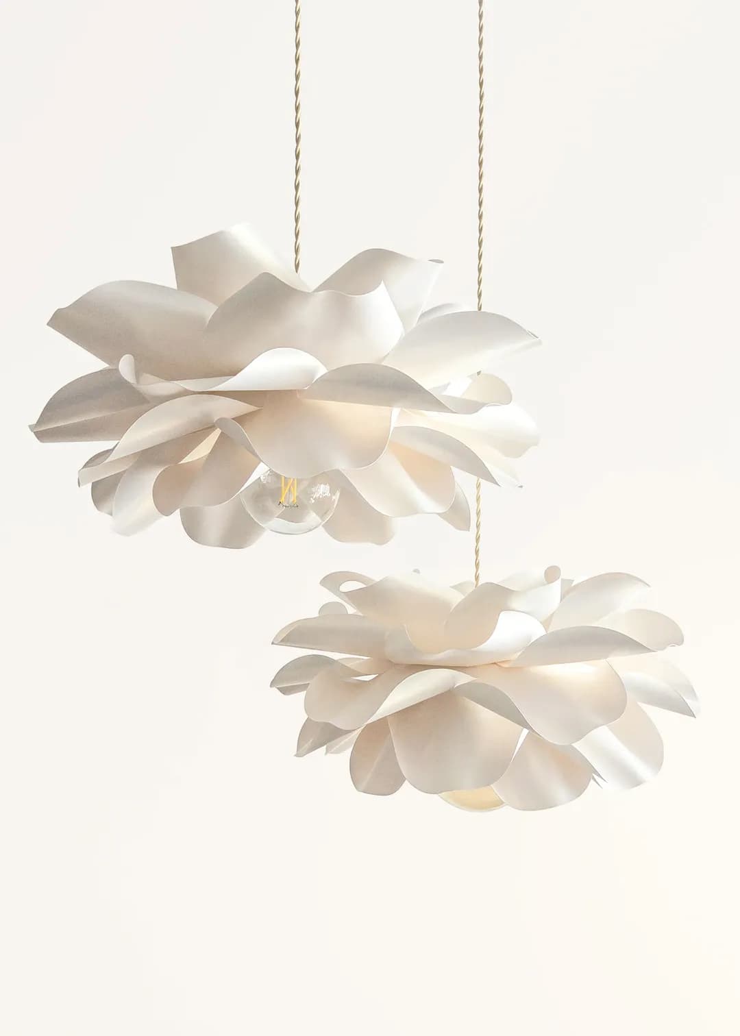Set of two ivory flower pendant lights at different heights